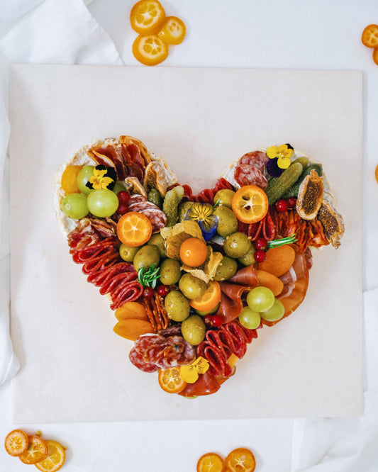 Love heart cheese and charcuterie platter, top view